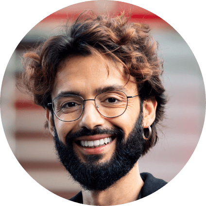 smiling-young-man-with-glasses-and-beard-2023-11-27-05-21-36-utc-min